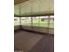 Enclosed patio with decorative brickwork, offering a view of the well-maintained street and landscaping at 11001 W Tonada Dr, Sun City, AZ 85351