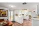 Well-lit kitchen with white cabinetry, a view to the backyard, and tile flooring at 115 E Piping Rock Rd, Phoenix, AZ 85022