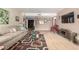 Spacious living room featuring neutral tones, tile accents, and comfortable furnishings at 115 E Piping Rock Rd, Phoenix, AZ 85022