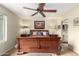 Comfortable main bedroom with ceiling fan, and traditional wood furnishings at 115 E Piping Rock Rd, Phoenix, AZ 85022