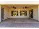 Covered patio with ceiling fans, providing a comfortable outdoor living space at 12820 W La Vina Dr, Sun City West, AZ 85375