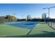 Well-maintained tennis court with lighting for evening play at 12820 W La Vina Dr, Sun City West, AZ 85375