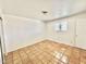 Bright bedroom features terracotta tiled flooring and a window at 1337 W Elna Rae St, Tempe, AZ 85281