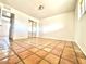 Bright bedroom features terracotta tiled flooring and a closet at 1337 W Elna Rae St, Tempe, AZ 85281