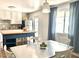 Kitchen and dining room features a wooden island with a sink and stainless steel appliances at 1337 W Elna Rae St, Tempe, AZ 85281