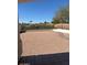 Low maintenance backyard featuring neutral toned gravel, minimal landscaping, and partially shaded patio area at 14240 N Ibsen Dr # B, Fountain Hills, AZ 85268