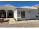 Charming home featuring a well-manicured yard, decorative fountain, and white exterior at 14240 N Ibsen Dr # B, Fountain Hills, AZ 85268