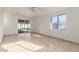 Bedroom featuring sliding glass door access to a patio at 1427 W 6Th Dr, Mesa, AZ 85202