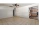 This room features neutral tile flooring and access to the kitchen, providing a versatile space at 1427 W 6Th Dr, Mesa, AZ 85202