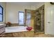 Bathroom with soaking tub, glass enclosed shower, and a large window at 150 N Lakeview Blvd # 1, Chandler, AZ 85225