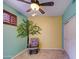 Charming bedroom featuring a custom tree wall graphic, a rocking chair, and a ceiling fan at 150 N Lakeview Blvd # 1, Chandler, AZ 85225