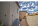 Exterior view of stucco home with multiple air conditioning units at 150 N Lakeview Blvd # 1, Chandler, AZ 85225