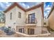 Stucco home with second story balcony and fenced patio below at 150 N Lakeview Blvd # 1, Chandler, AZ 85225