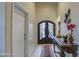 Elegant entryway showcasing a decorative front door, console table, and tiled flooring at 150 N Lakeview Blvd # 1, Chandler, AZ 85225