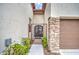 Elegant gated entrance with stone accents leading to a front door at 150 N Lakeview Blvd # 1, Chandler, AZ 85225