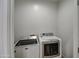 Laundry room with a white front-load washer and dryer at 150 N Lakeview Blvd # 1, Chandler, AZ 85225