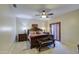 Main bedroom featuring carpet, ceiling fan, and dark wood furniture at 150 N Lakeview Blvd # 1, Chandler, AZ 85225