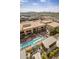 Aerial view of rooftop pool and multi-Gathering apartments with city skyline and mountain views at 15215 N Kierland Blvd # 633, Scottsdale, AZ 85254