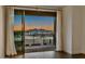 Balcony with sliding glass doors offering a view of the sunset and cityscape at 15215 N Kierland Blvd # 633, Scottsdale, AZ 85254