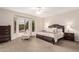 Serene main bedroom with a bay window, plush furnishings, and abundant natural light at 15850 W Silver Breeze Dr, Surprise, AZ 85374