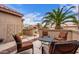 Inviting outdoor seating area with comfortable chairs and a table, perfect for relaxing and entertaining at 15850 W Silver Breeze Dr, Surprise, AZ 85374