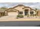 Charming single-story home with desert landscaping and a two-car garage at 16388 N 99Th Pl, Scottsdale, AZ 85260