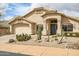 Attractive home with a well-maintained desert rock yard and mature cacti at 16388 N 99Th Pl, Scottsdale, AZ 85260