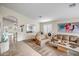 Bright living room featuring comfortable seating, an elegant mirror, and stylish decor for a welcoming atmosphere at 16388 N 99Th Pl, Scottsdale, AZ 85260