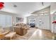 Inviting living room with large windows, a vaulted ceiling, and tile floors at 16388 N 99Th Pl, Scottsdale, AZ 85260