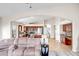 Open concept living room showcasing archways to kitchen and dining areas, with neutral paint and tile throughout at 16388 N 99Th Pl, Scottsdale, AZ 85260