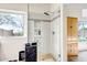 Spa-like bathroom features tiled floors, glass shower with tiled surround, and lots of natural light at 16388 N 99Th Pl, Scottsdale, AZ 85260