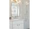 Bathroom featuring stone floors, floating vanity with gold hardware, and frameless glass shower at 16409 N 62Nd Way, Scottsdale, AZ 85254