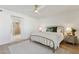 Bright bedroom with hardwood floors, metal bed frame, and ceiling fan at 16409 N 62Nd Way, Scottsdale, AZ 85254