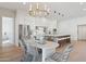 Elegant dining room with a chandelier, view to kitchen, and seating for six at 16409 N 62Nd Way, Scottsdale, AZ 85254