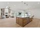 Open kitchen featuring an island with a sink, views to the living room, and stainless appliances at 16409 N 62Nd Way, Scottsdale, AZ 85254