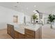 Bright, modern kitchen features a farmhouse sink, stainless steel appliances, and quartz countertops at 16409 N 62Nd Way, Scottsdale, AZ 85254