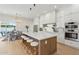 Kitchen featuring white cabinets, a large center island with bar seating, and stainless steel appliances at 16409 N 62Nd Way, Scottsdale, AZ 85254