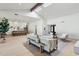 Bright, open-concept living room featuring vaulted ceilings, skylights, and seamless flow to kitchen at 16409 N 62Nd Way, Scottsdale, AZ 85254