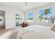 Bright main bedroom with pool view, neutral decor, and private outdoor access at 16409 N 62Nd Way, Scottsdale, AZ 85254