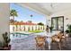 Covered outdoor dining area by the pool, perfect for entertaining guests at 16409 N 62Nd Way, Scottsdale, AZ 85254