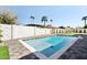 Beautiful backyard swimming pool and patio with lush landscaping and sunshine at 16409 N 62Nd Way, Scottsdale, AZ 85254