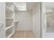 Walk-in closet featuring built-in shelving and a hanging rack for ample storage at 16409 N 62Nd Way, Scottsdale, AZ 85254