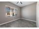 Bright bedroom with a window overlooking the neighborhood and tiled floors at 16617 S 16Th Ave, Phoenix, AZ 85045