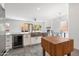 Bright, modern kitchen with stainless steel appliances, an undermount sink, and tile flooring at 16617 S 16Th Ave, Phoenix, AZ 85045