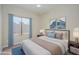 Comfortable bedroom featuring a plush bed, blue accents, and calming artwork at 18823 N 41St Dr, Glendale, AZ 85308
