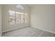 Bright bedroom features large window, neutral walls, and wood-look floors at 18823 N 41St Dr, Glendale, AZ 85308