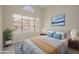 Comfortable bedroom features a large window, neutral walls, and a cozy bed at 18823 N 41St Dr, Glendale, AZ 85308