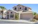 Charming two-story home featuring a unique architectural design and a well-maintained front yard at 18823 N 41St Dr, Glendale, AZ 85308