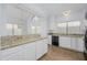Spacious kitchen features granite countertops, white cabinetry and modern appliances at 18823 N 41St Dr, Glendale, AZ 85308