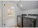 Convenient laundry room with modern black appliances and ample space at 18823 N 41St Dr, Glendale, AZ 85308